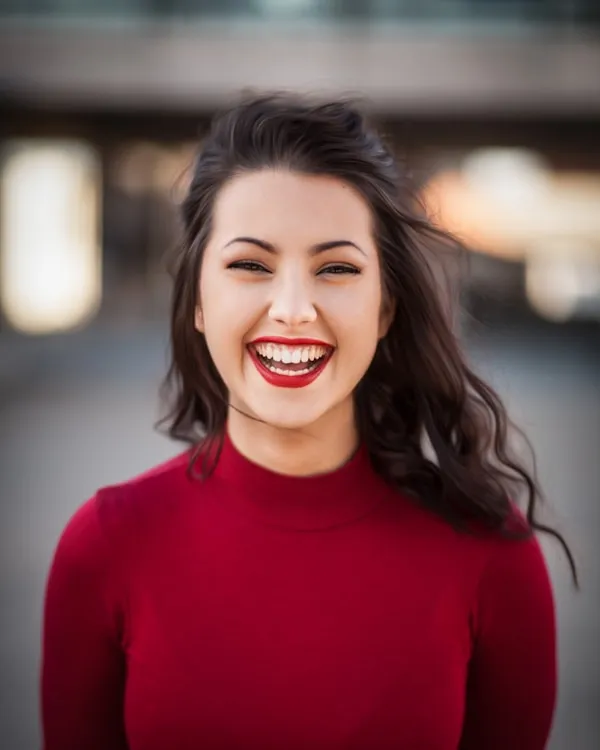 Woman laughing with joy and confidence